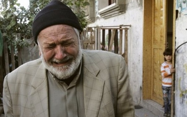 A Palestinian relative of Hamas militant Rushdi Mohareb reacts after his body was carried out of the family home, during his funeral in Khan Younis refugee camp, southern Gaza Strip, Wednesday, Nov. 5, 2008. Hamas militants pounded southern Israel with a barrage of rockets Wednesday, hours after Israeli forces killed six gunmen, a fresh bout of violence that threatened to unravel a five-month-old truce that has brought relief to both Gaza and southern Israel. The clashes began late Tuesday after the Israeli army burst into Gaza to destroy what it said was a tunnel being dug near the border to abduct Israeli troops. (AP Photo/Khalil Hamra)